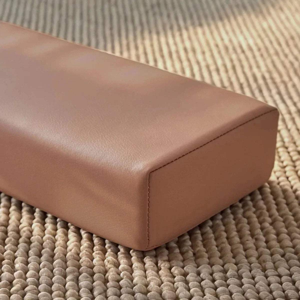 Taupe padded balance beam close-up with smooth top and stitched corner