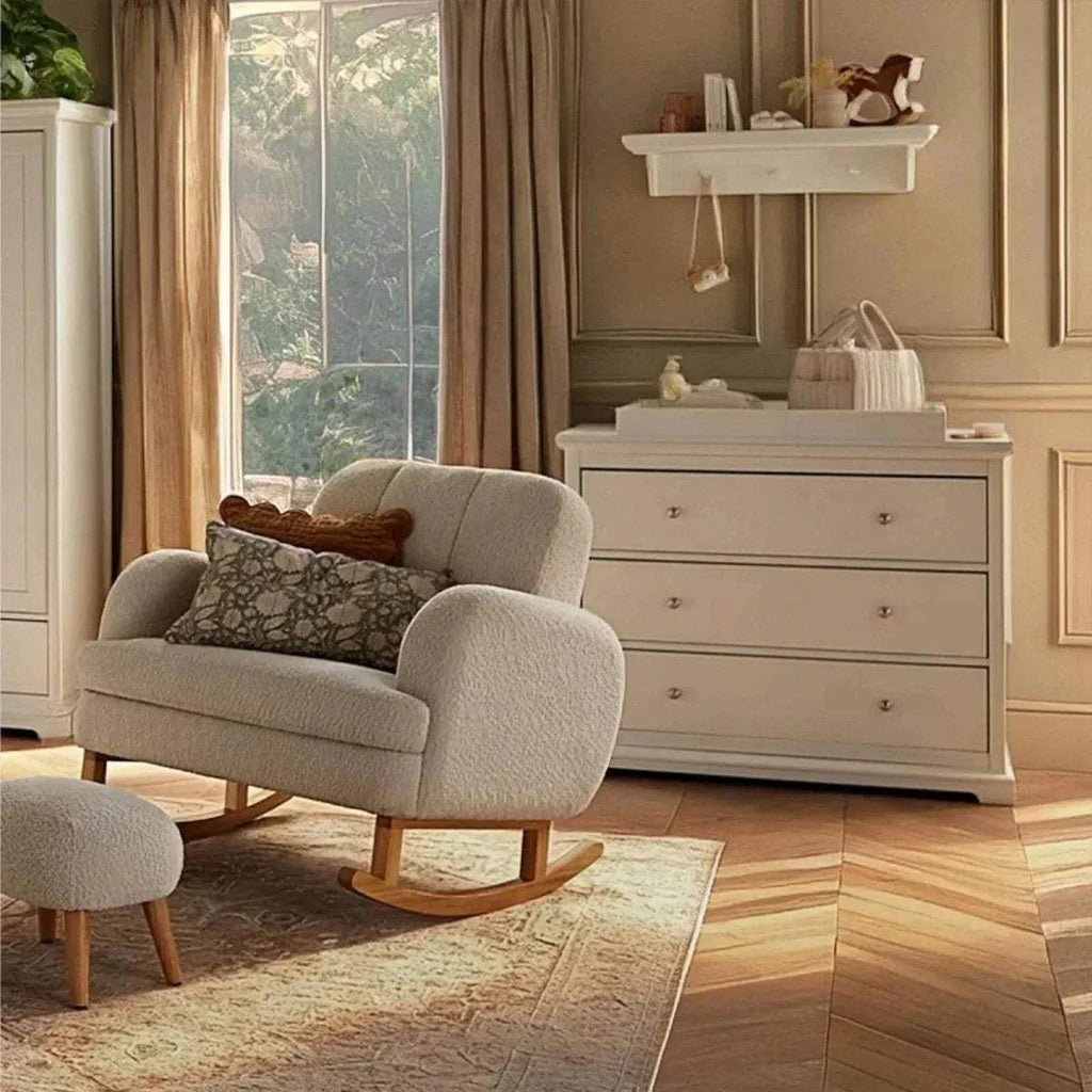 White wall shelf with underside pegs, mounted above a dresser