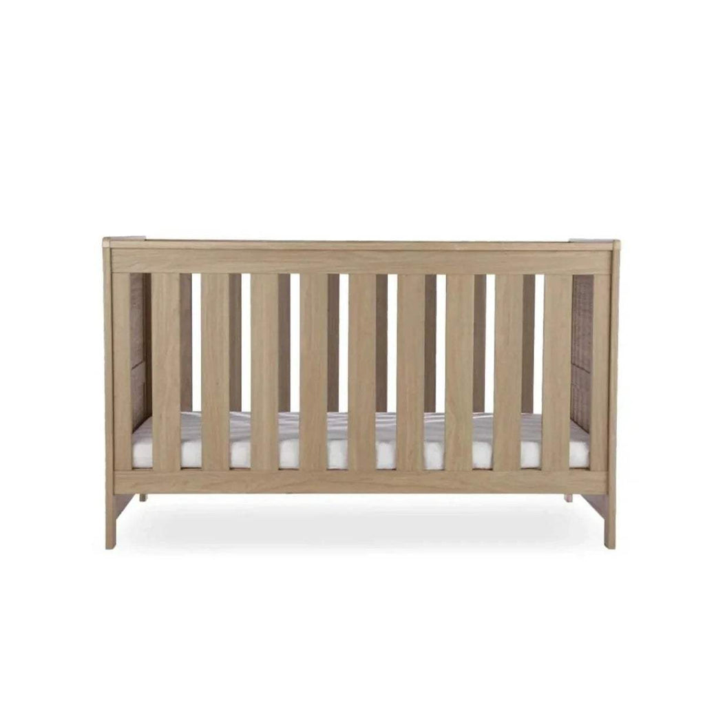Oak cot bed frame with vertical slats and low guard rails