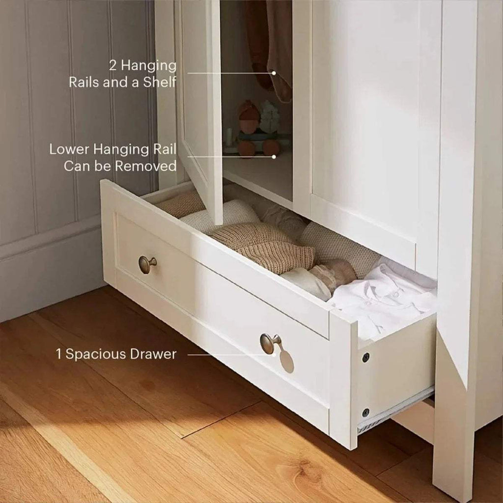 White wardrobe with extended lower drawer, showing hanging rail and storage shelf.