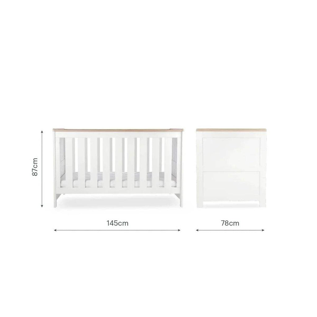 White nursery cot with matching small cabinet, with size dimensions shown
