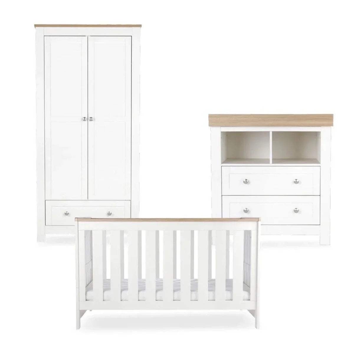 White crib with slatted sides, shown with matching wardrobe and storage dresser