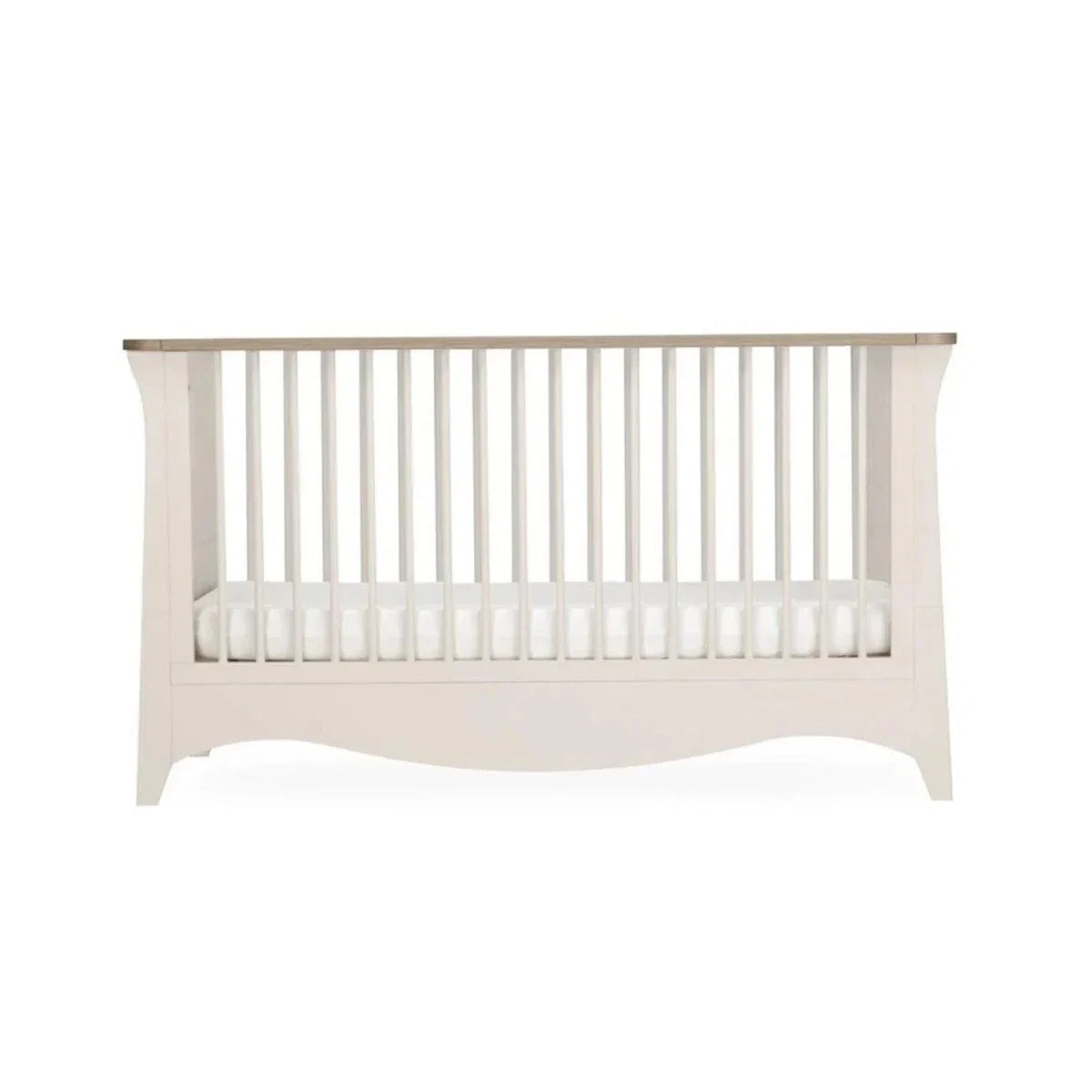 White nursery crib with vertical slat guard rails, front view
