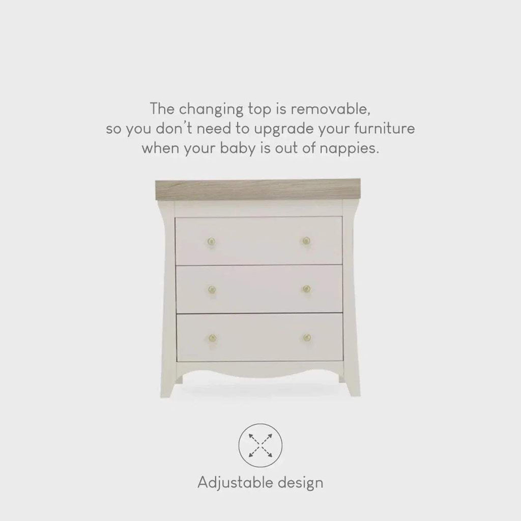 White dresser changer with three drawers and removable changing top