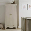 White 2-door nursery wardrobe with gold knobs and bottom drawer