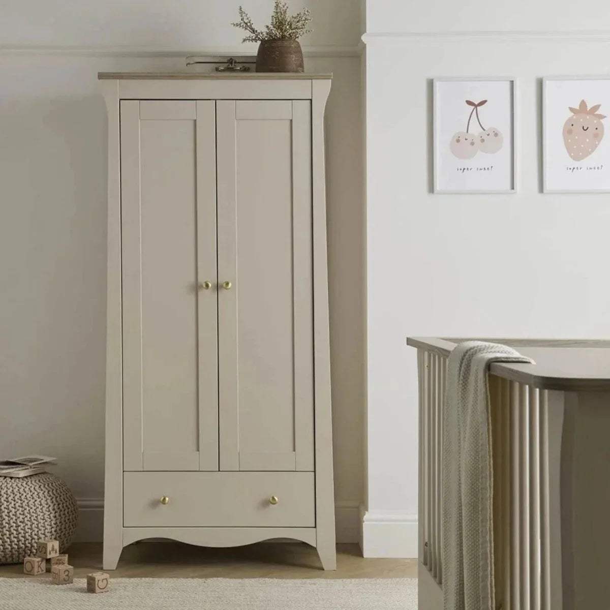 White 2-door nursery wardrobe with gold knobs and bottom drawer