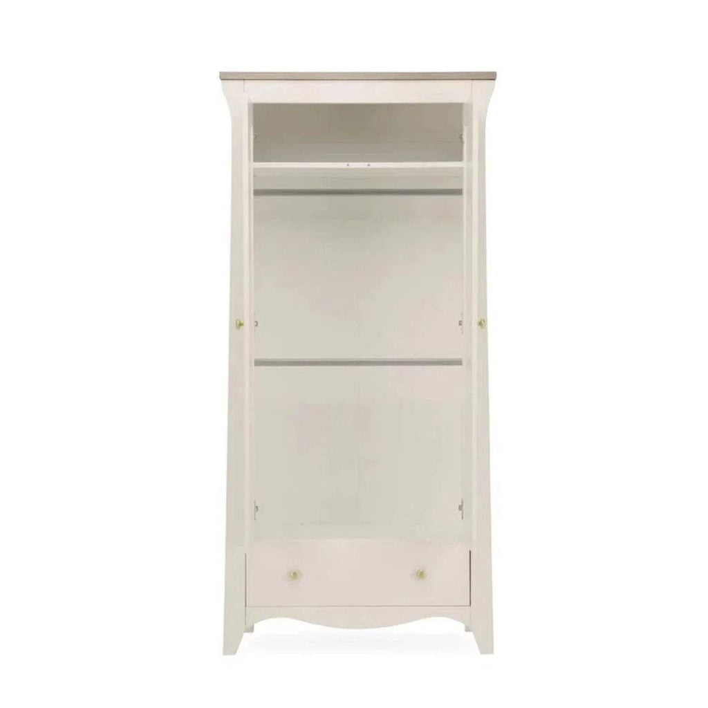 White wardrobe open inside with shelf and hanging rail, gold hinges