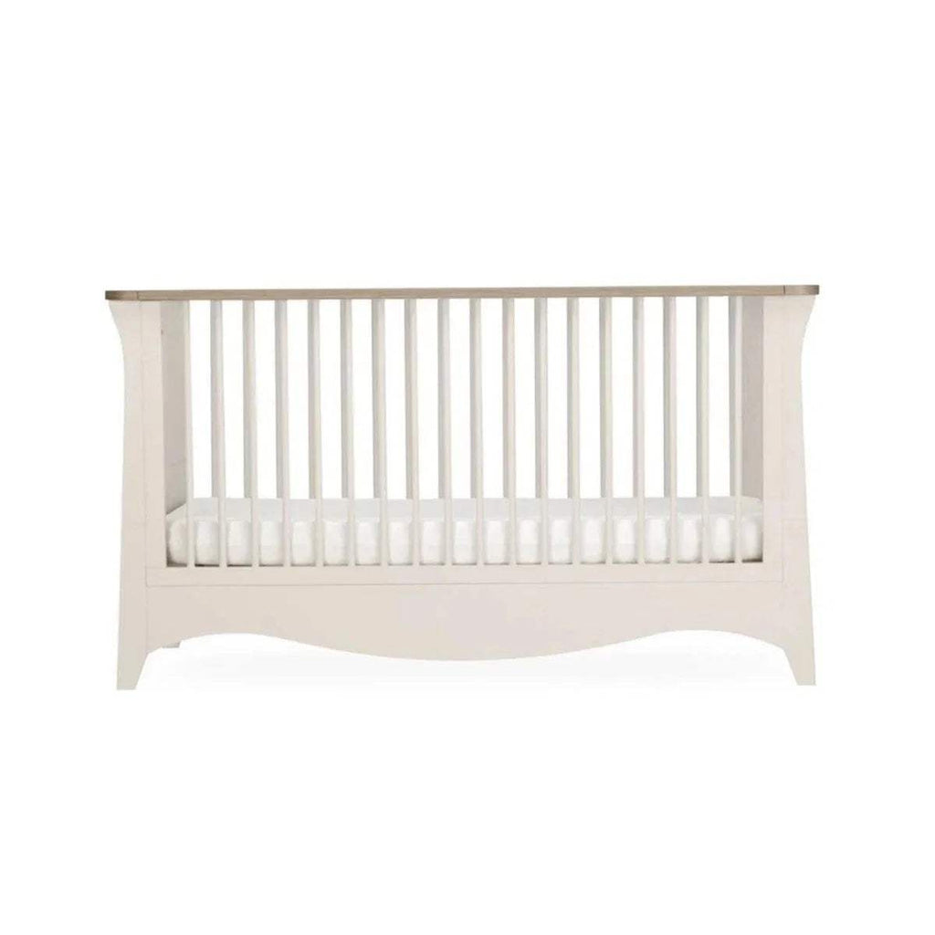 White cot bed end panel with vertical slats and flat footboard