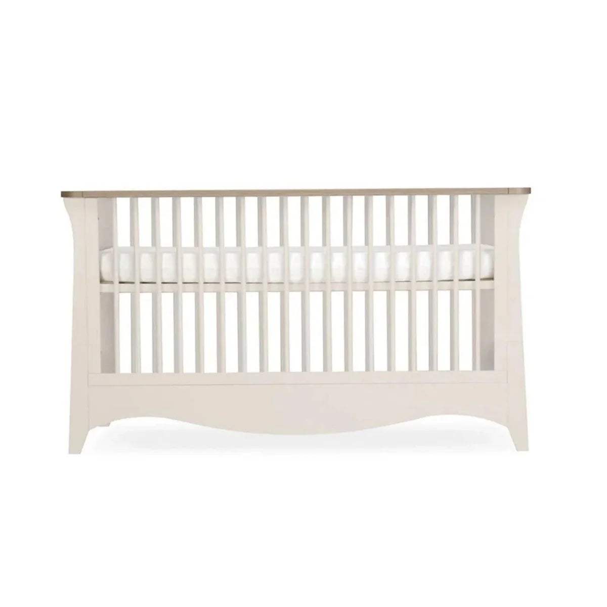 White cot bed with vertical slat headboard and open side rails