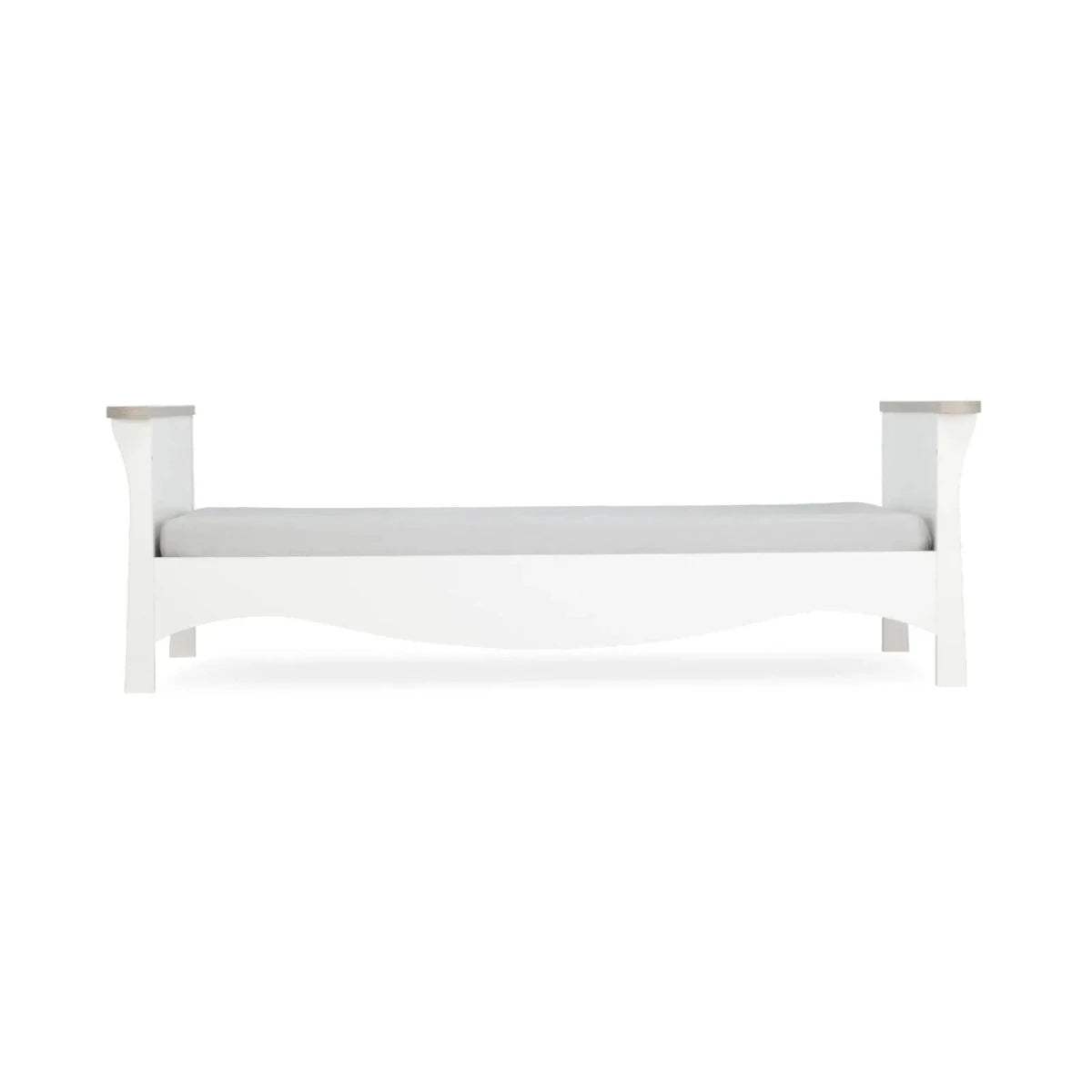 White toddler bed frame with side rails and corner posts