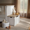 White storage box with light wood top and large flip-down handle opening