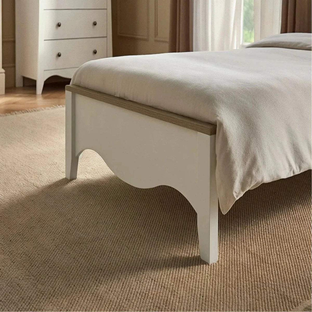 White single bed front panel with arched cutout and upholstered top edge