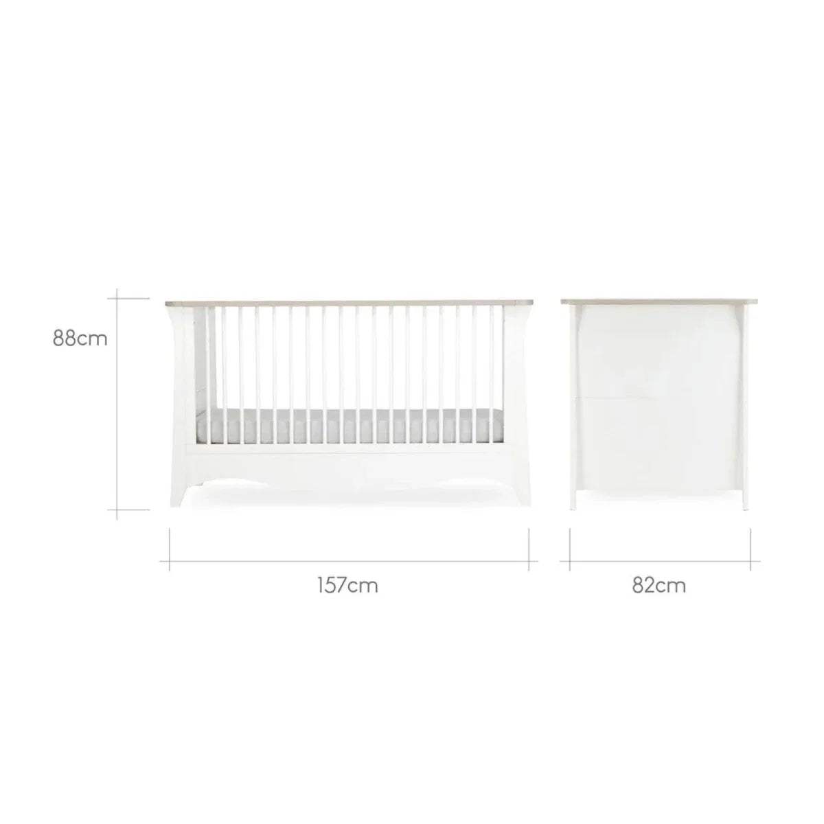 White nursery bed with raised side rails and end panel, side profile view