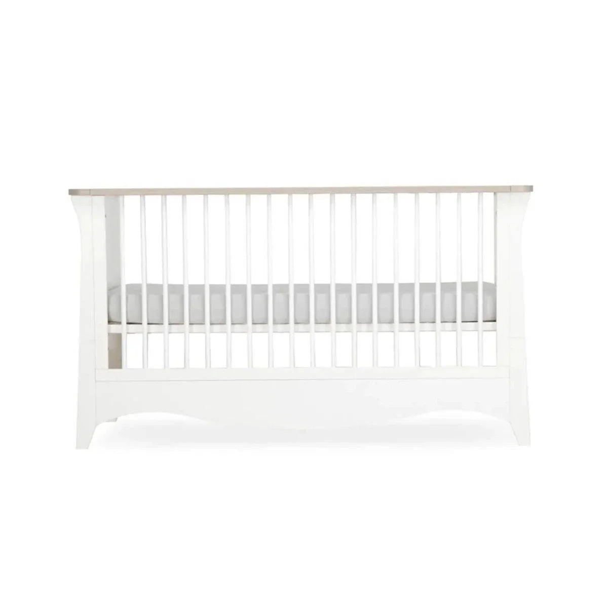 White nursery crib side panel with vertical slats and curved base
