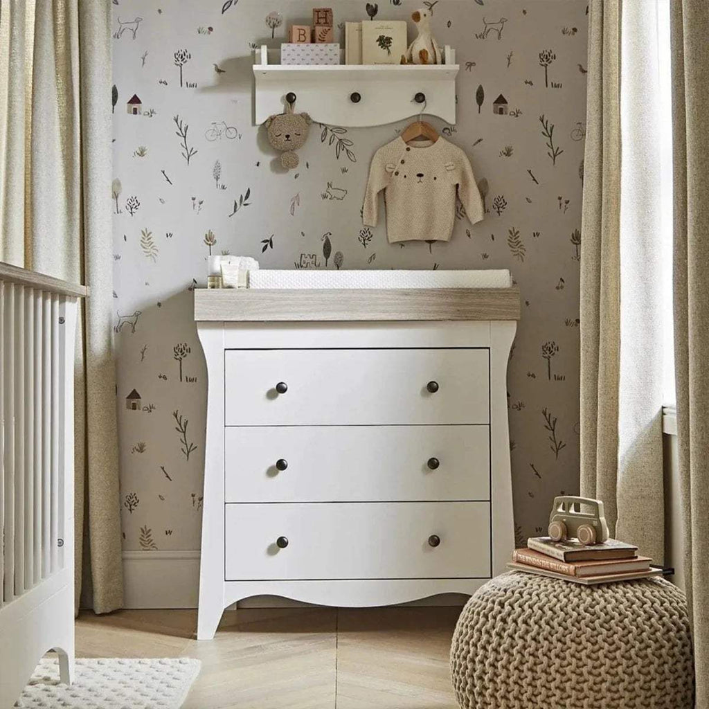 White and ash 3-drawer baby dresser changer with curved base and metal knobs
