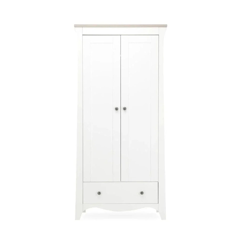 White freestanding wardrobe with two doors, round metal knobs, and bottom drawer
