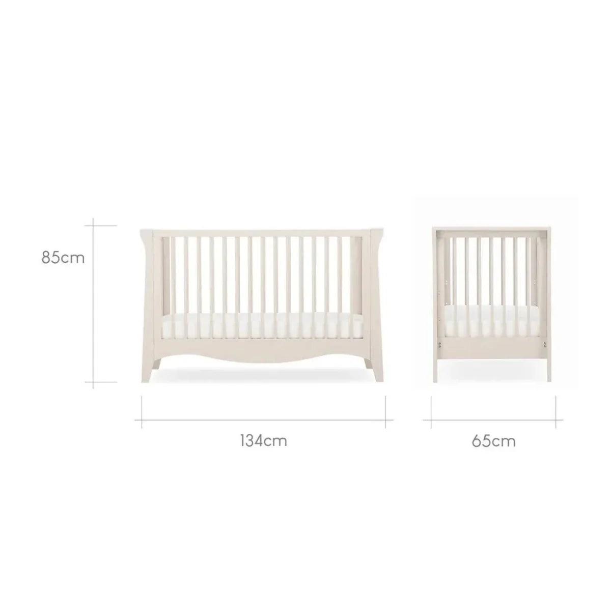 White nursery bed frame with matching small open-slat cabinet