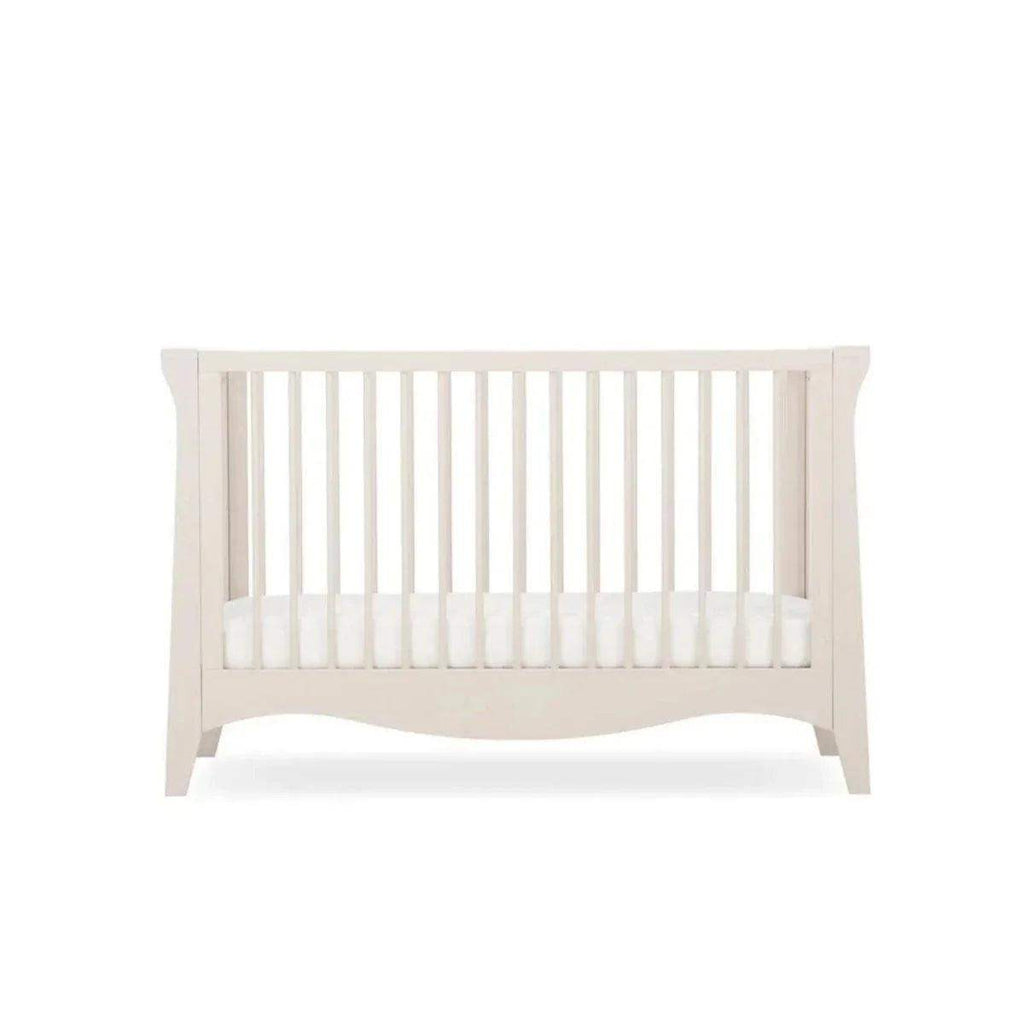 White mini cot bed front with vertical rails and curved edges