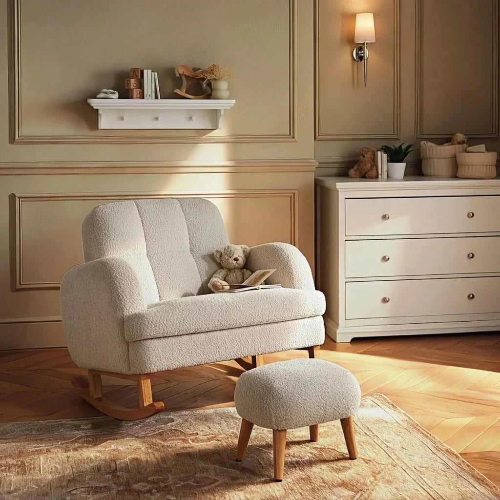 Light beige boucle nursing chair with curved base and matching ottoman/foot stool