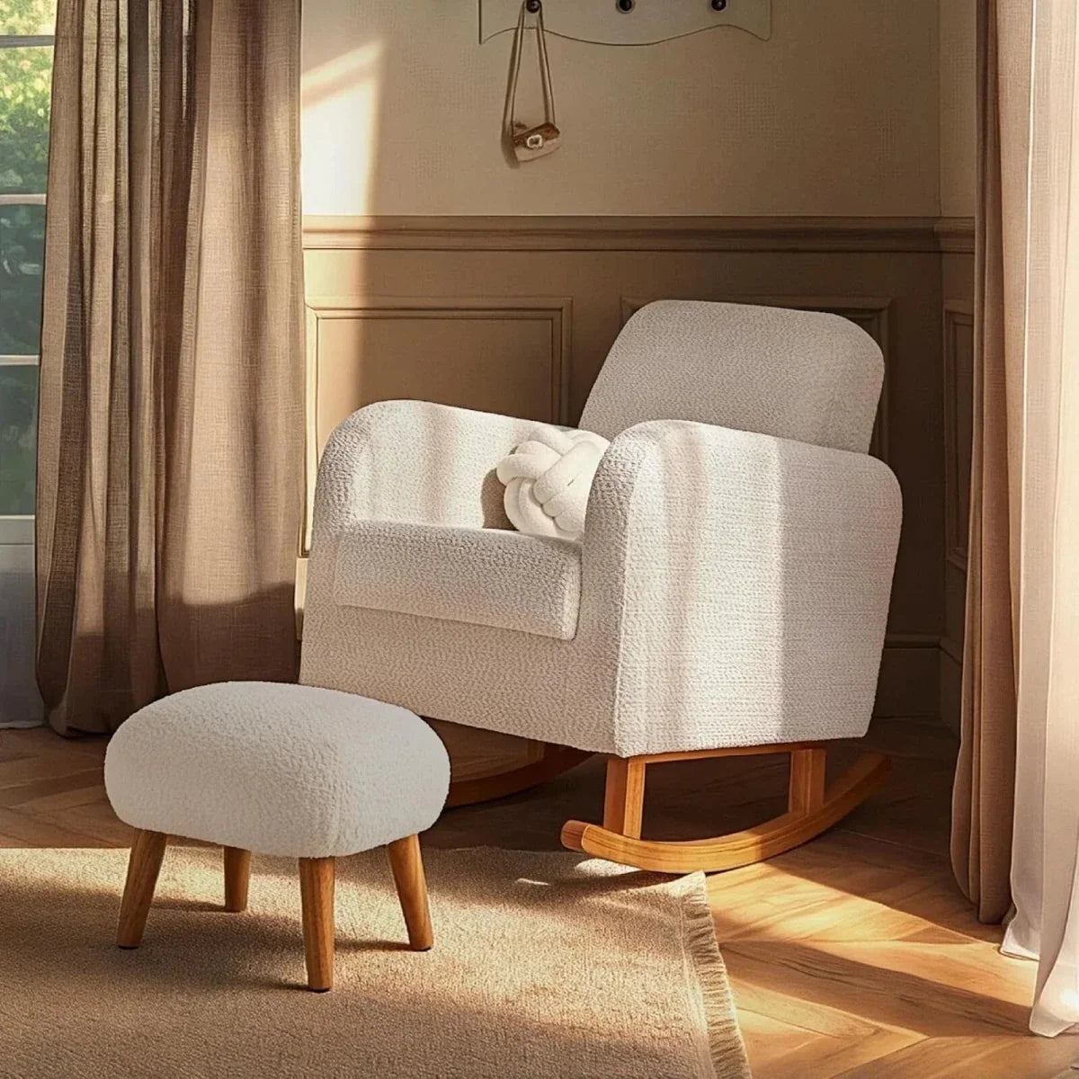 Boucle nursing chair with wooden rocking base and matching foot stool