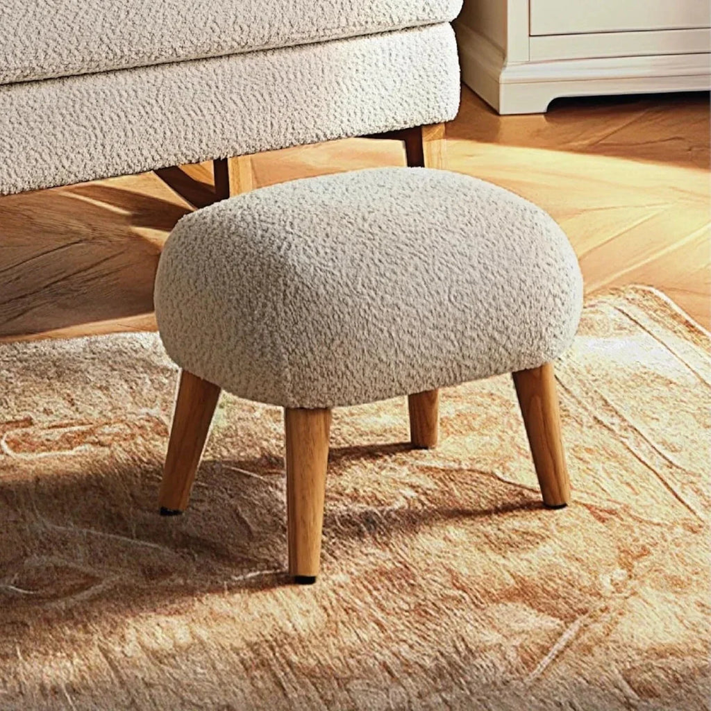 Boucle mushroom foot stool with rounded top and four wooden legs