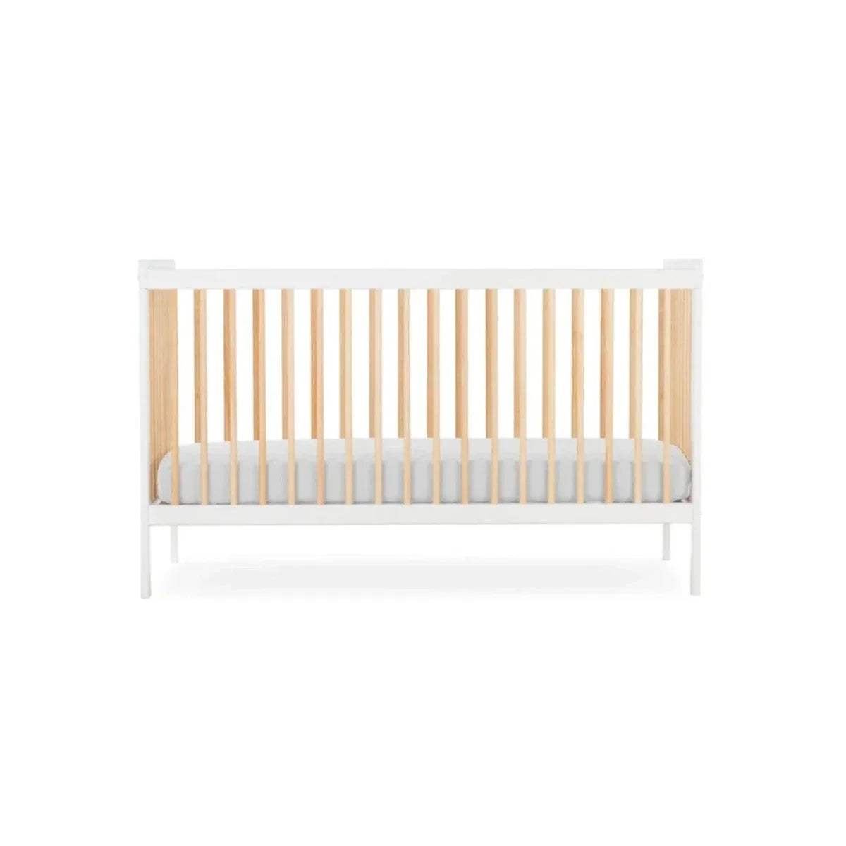 White cot bed with natural wooden slats and light grey padded mattress insert, front view.
