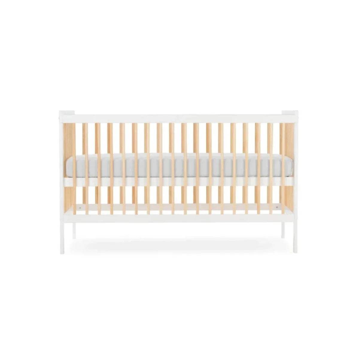 White cot bed with natural vertical slats and light grey mattress insert, side view.