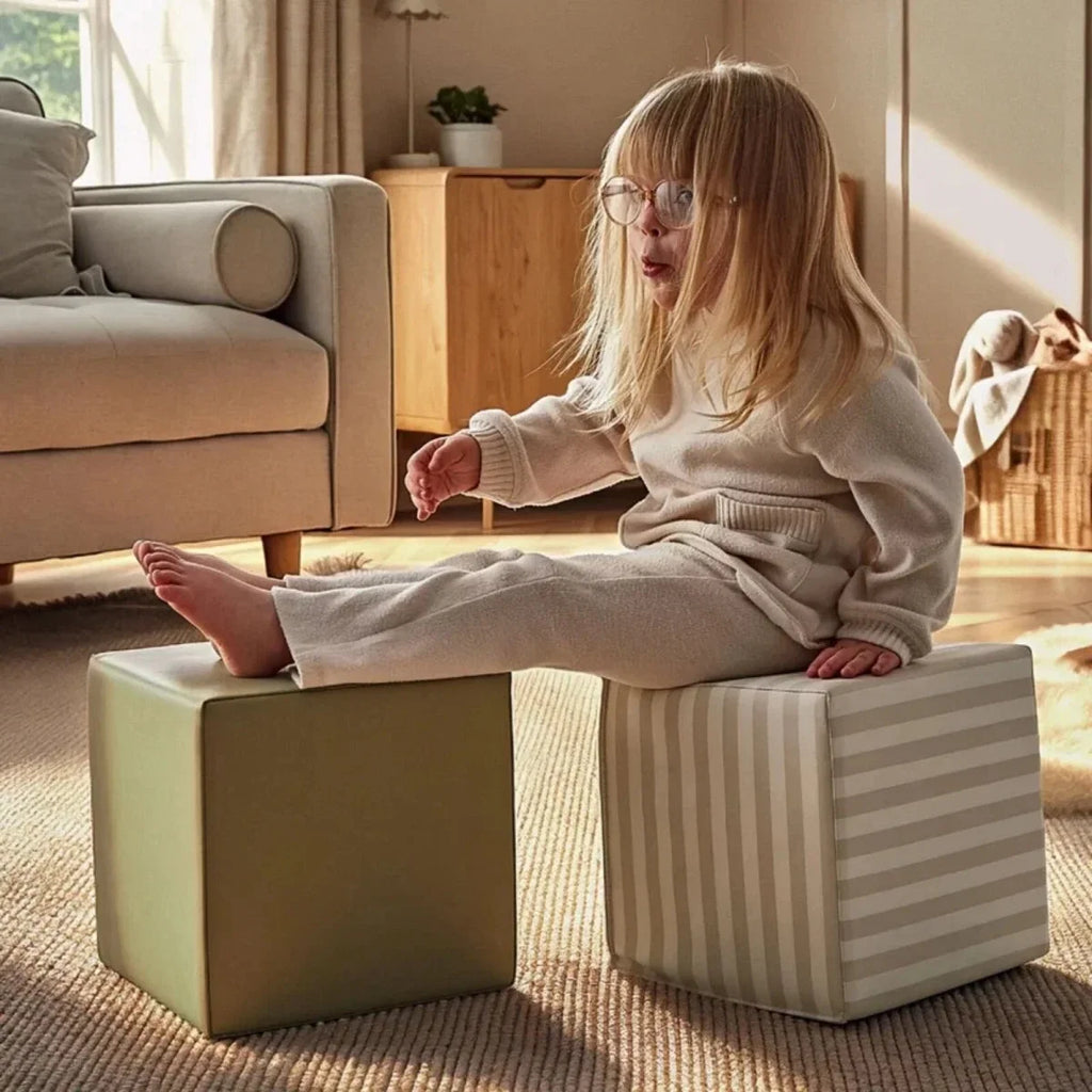 Soft play cubes with olive cube and light cookie stripe cube on floor