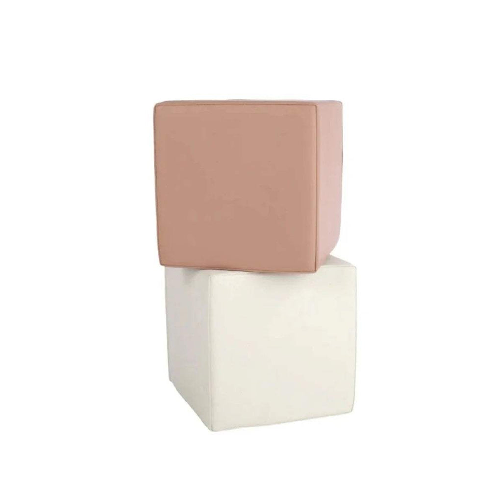 Stacked square play cubes with tan top and cream bottom