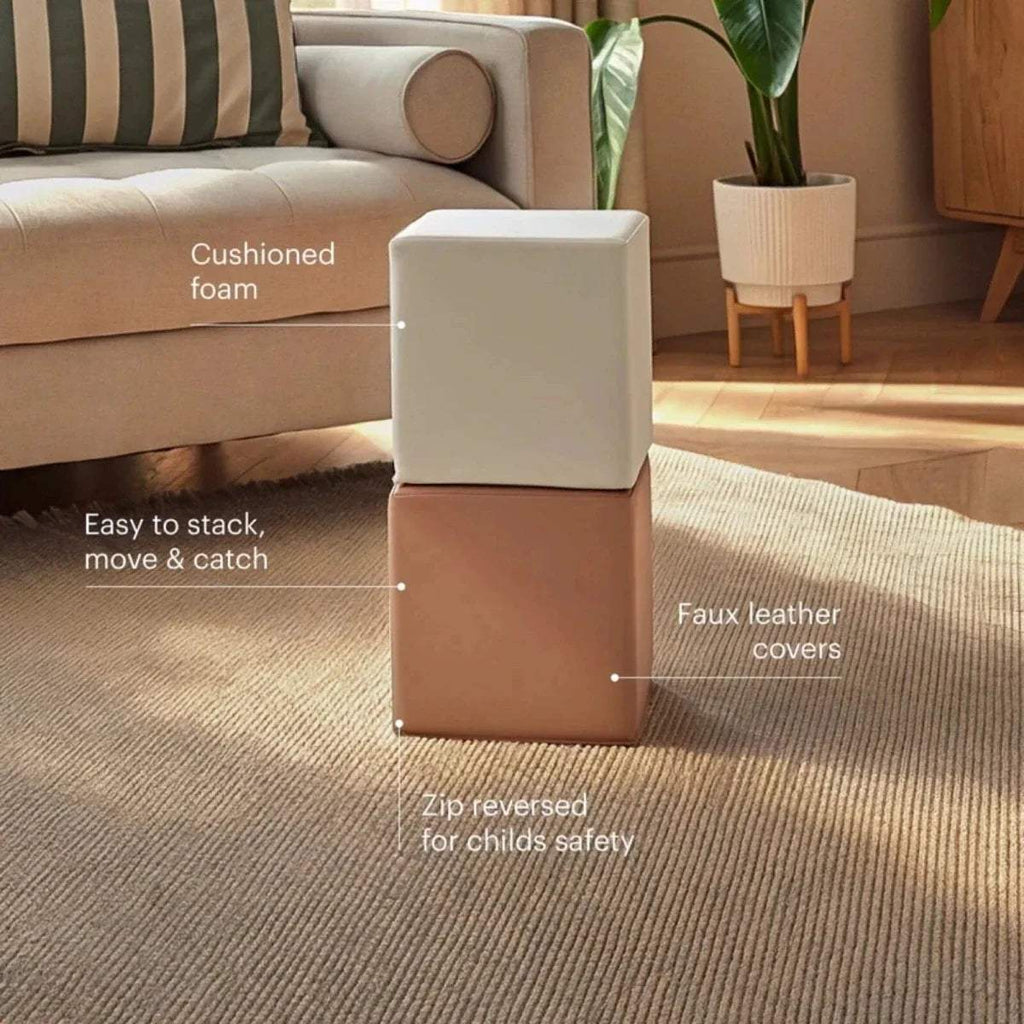 Two stacked play cubes with faux leather covers, cream and tan