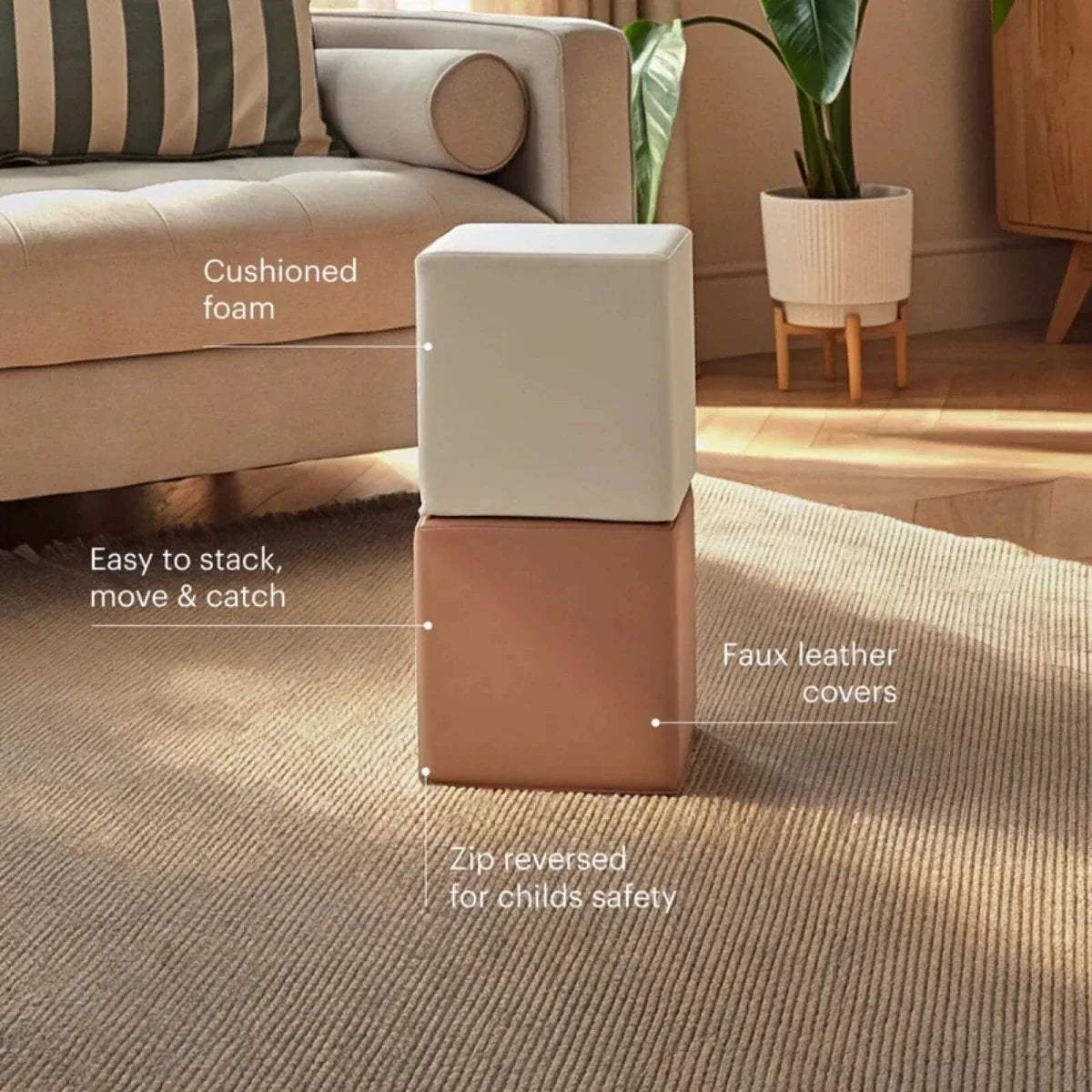 Two stacked play cubes with faux leather covers, cream and tan