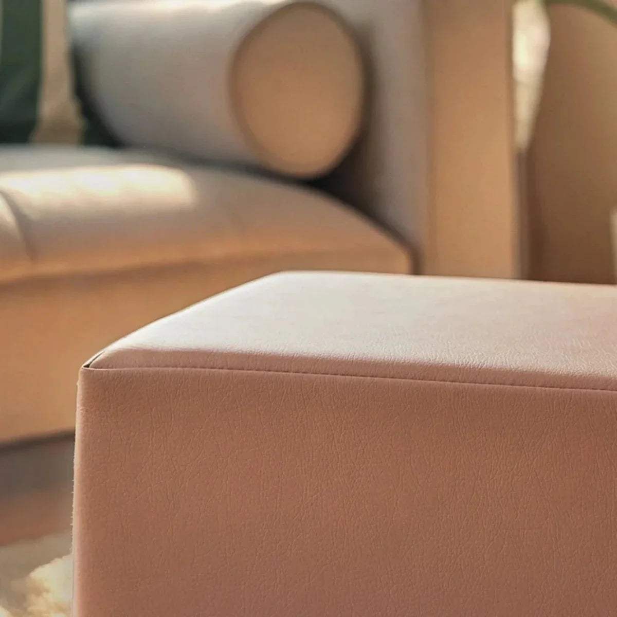 Tan faux-leather cube cover on a cushioned foam block