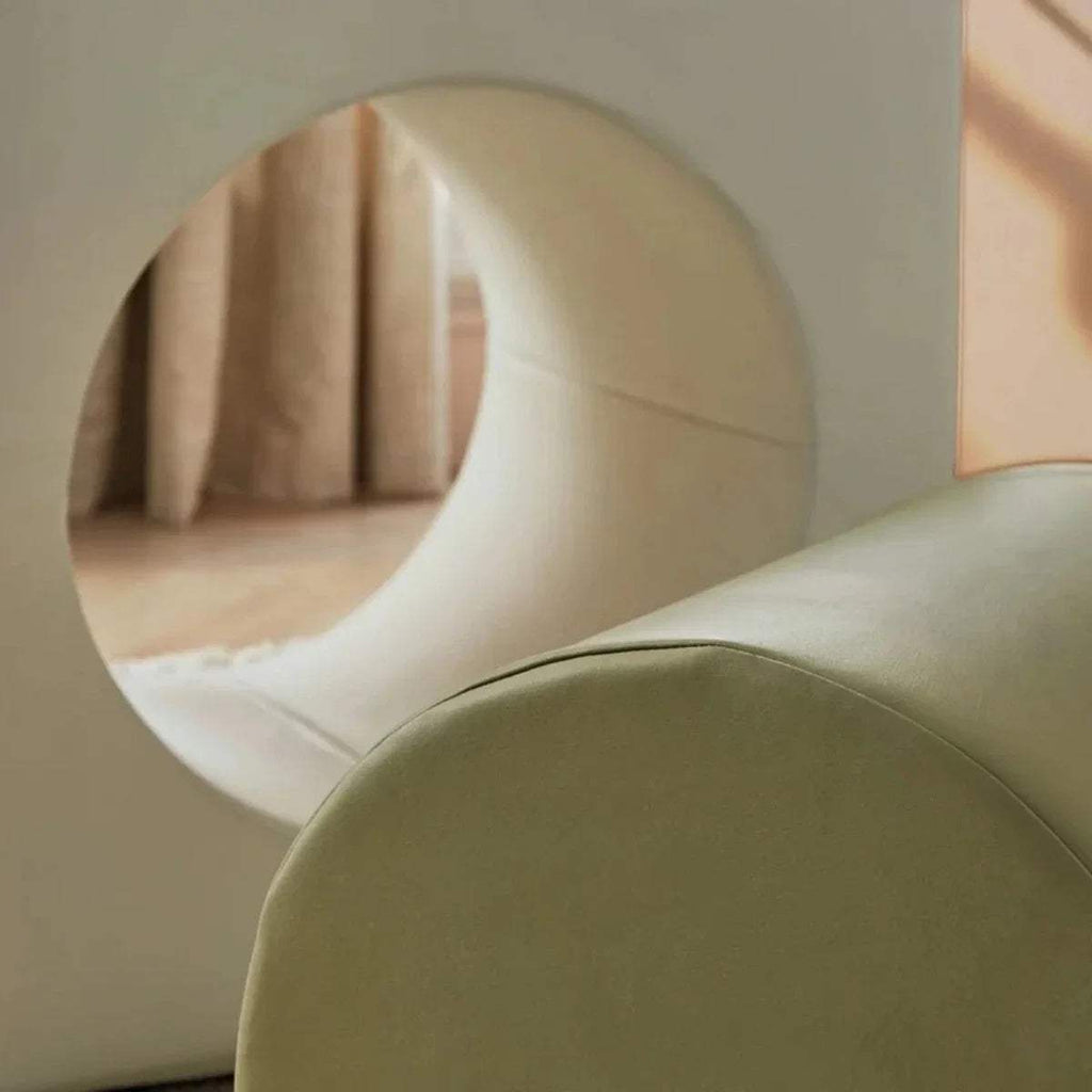 Tunnel play block with circular opening and padded interior in cream and olive
