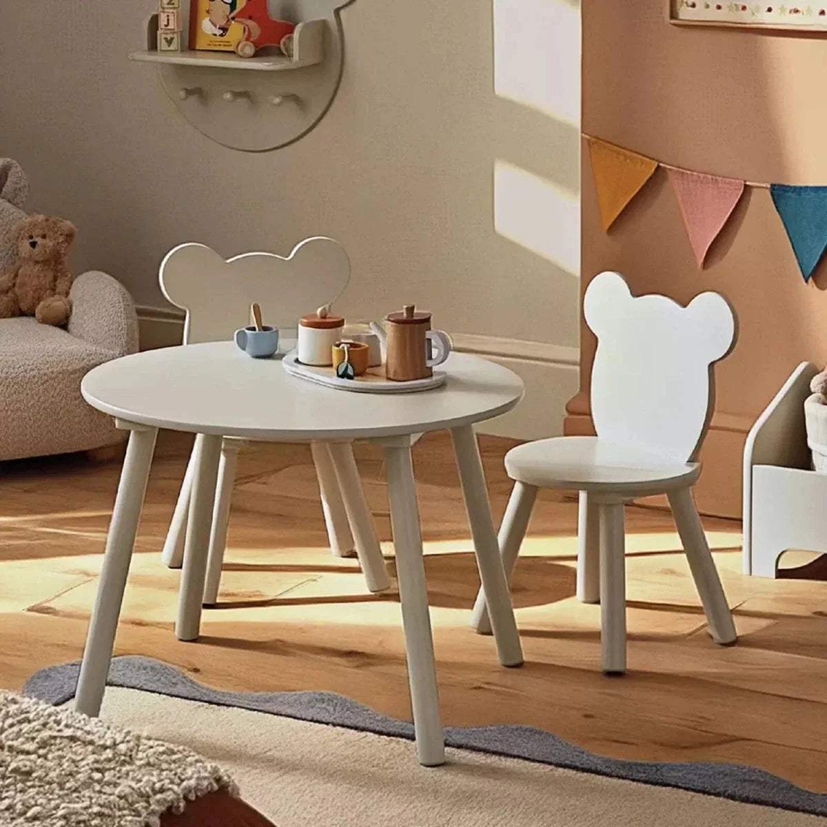 Kids play table with light gray round top and two bear-back chairs with cutout ears