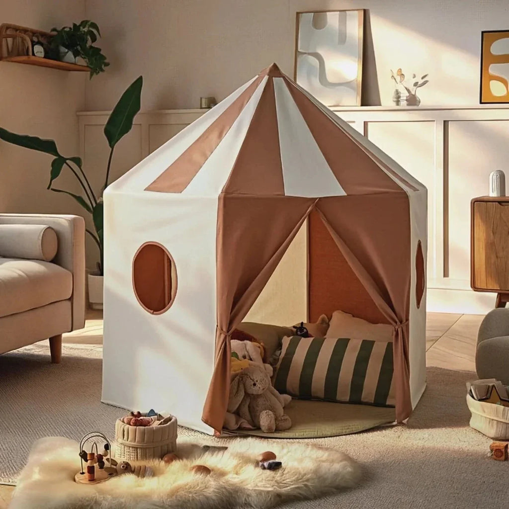 Play tent with cream canvas panels and brown triangular roof, oval side window and open front