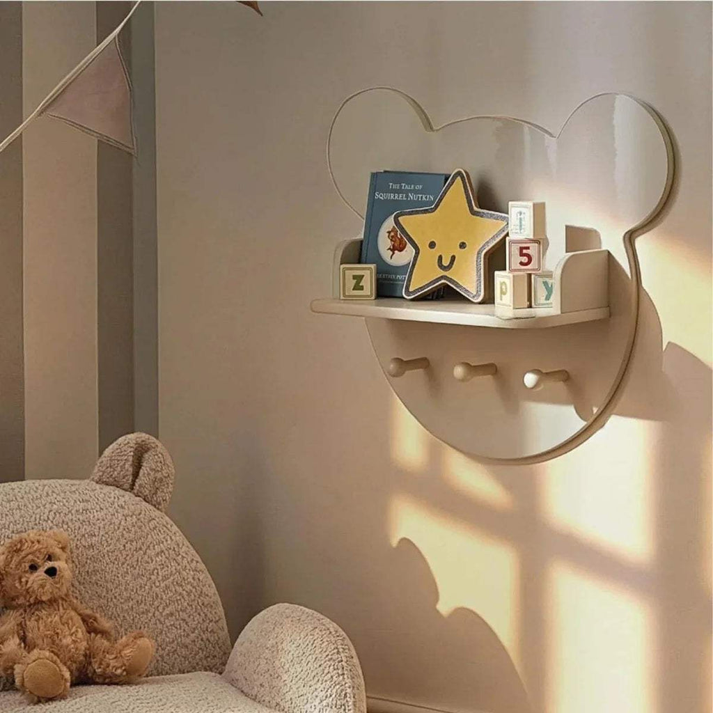Bear-shaped wall shelf with 3 front pegs and curved top, pebble beige finish