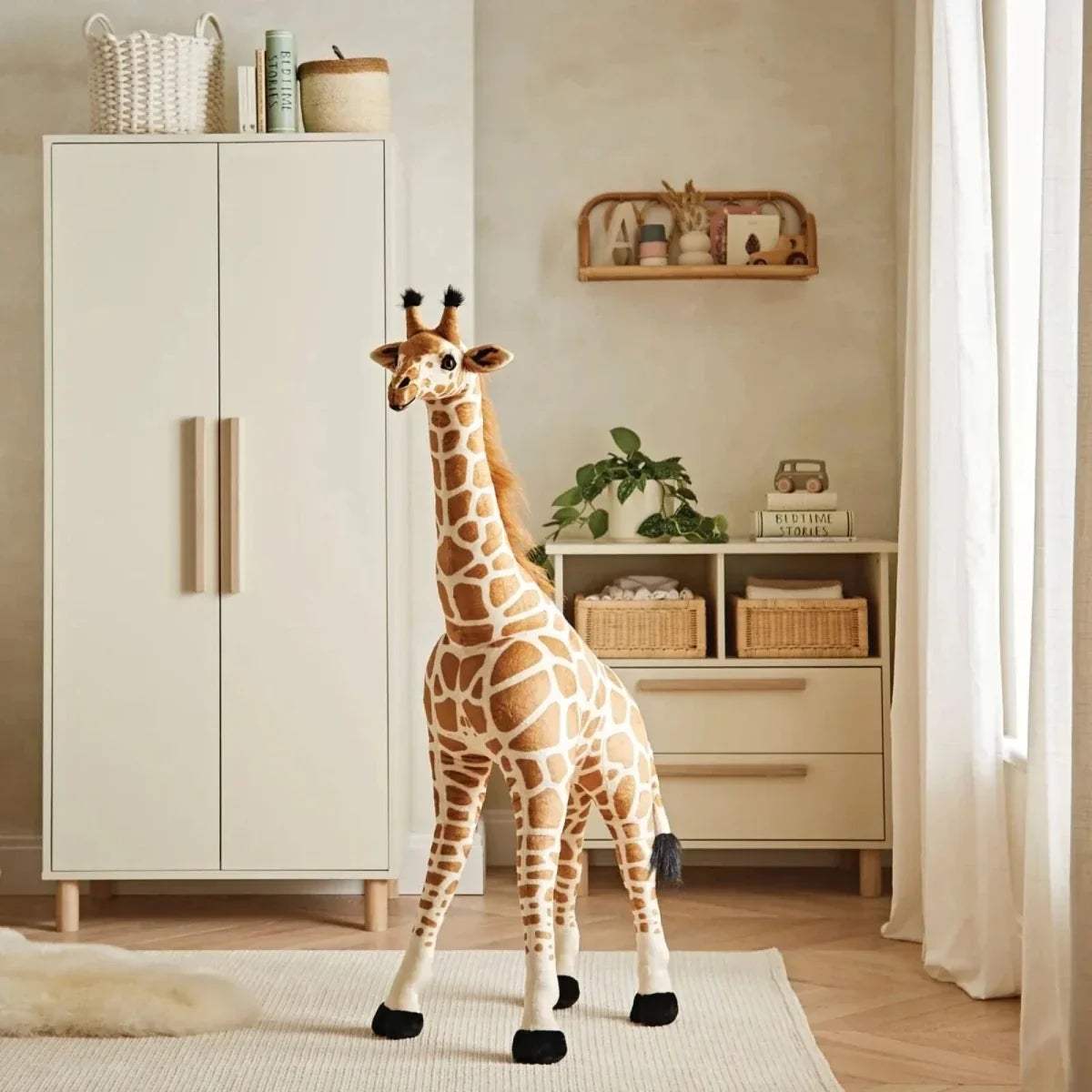 Standing plush giraffe stuffed animal with brown-and-cream print and black feet.