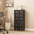 Black media shelf tower with two open columns of CD storage compartments