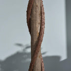 Artificial bay laurel topiary trunk close-up with brown bark texture