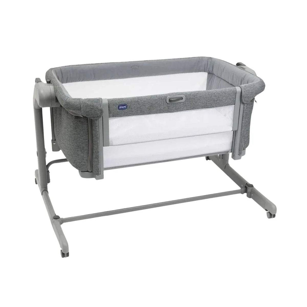 Dark gray bedside crib with white insert and padded side rails