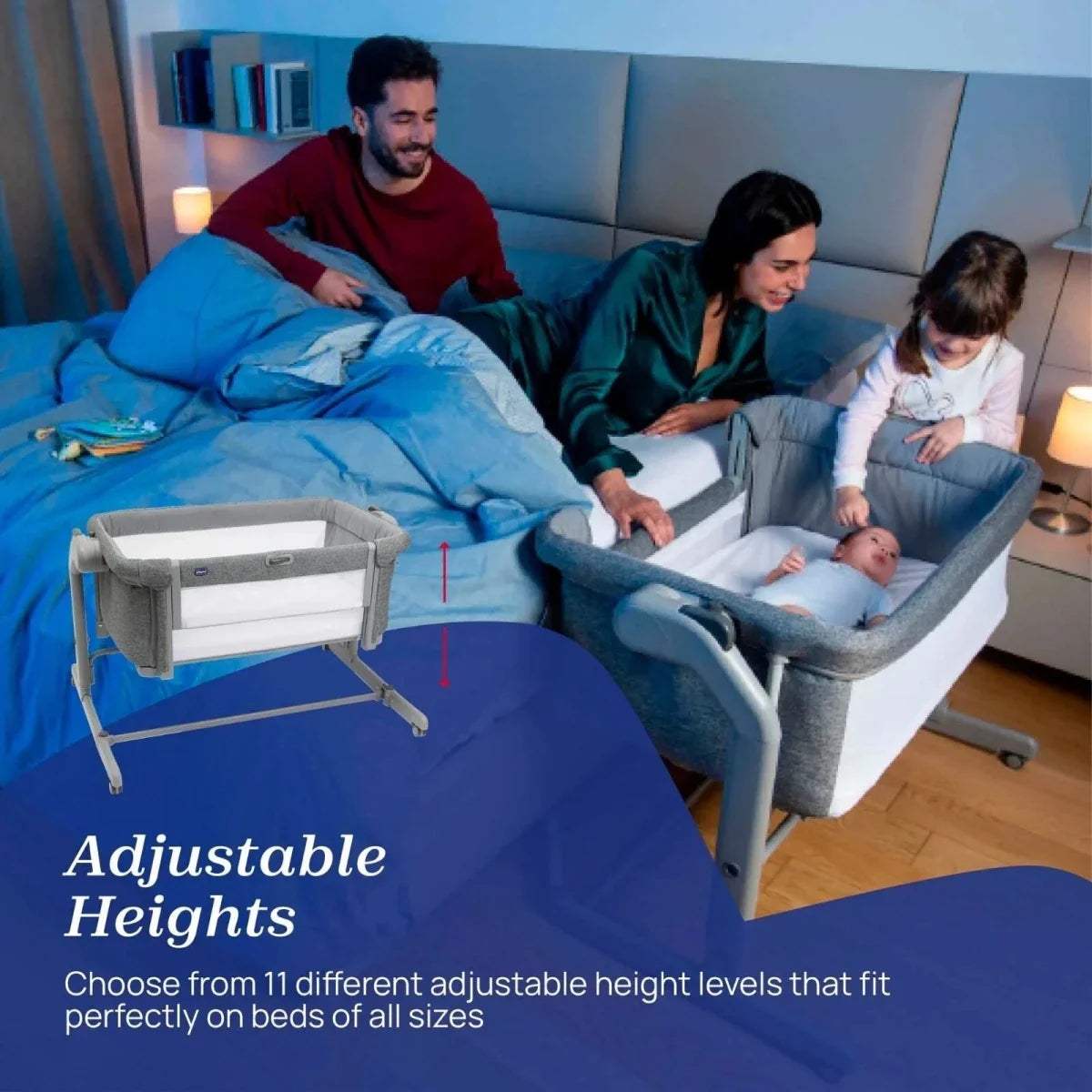 Dark gray bedside crib with white mattress set between adults and a baby