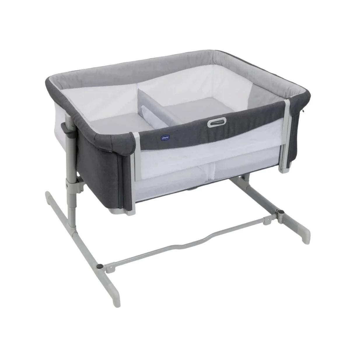 Magnet grey twin bedside crib with padded sides and white inner mattress