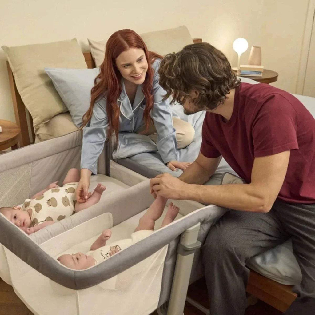 Magnet grey twin bedside crib with parents and two babies inside
