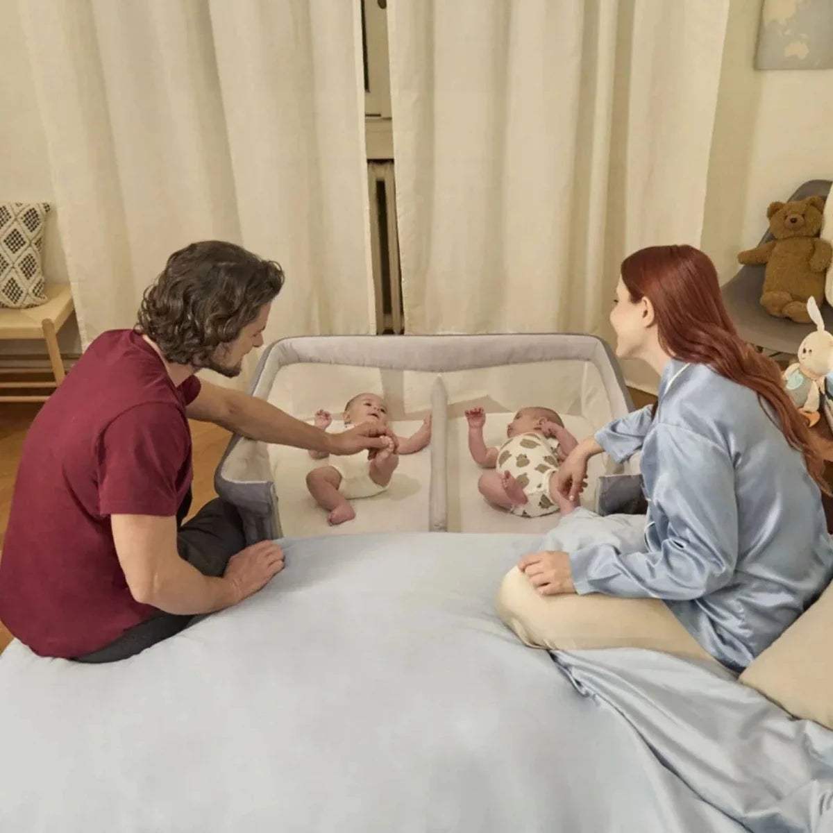 Magnet grey twin bedside crib with mesh sides and twin sleeping spaces
