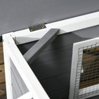 Close-up of grey wooden dog kennel roof panel latch and black roof cover