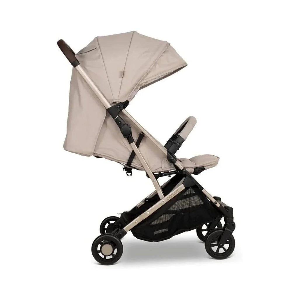 Beige stroller, side view with canopy and harness, black wheels and frame