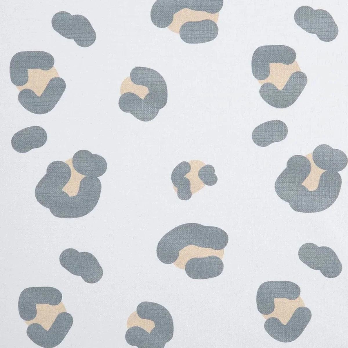 Muted leopard print fabric pattern with blue-gray and tan spots on white