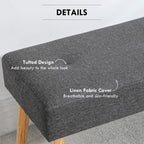 Grey tufted upholstered bench ottoman corner detail with textured fabric look