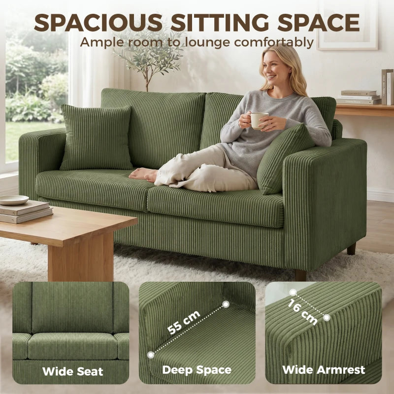 Green corduroy loveseat sofa with deep seating and wide armrests