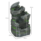 Dark grey stacked rock water fountain with green moss details
